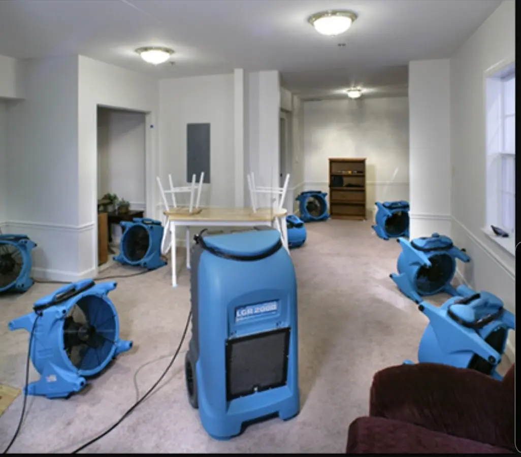 Air movers and dehumidifier setup for Water Damage Restoration in Lee